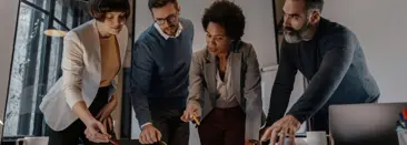 A diverse team collaborating in a modern office, working together to achieve their goals