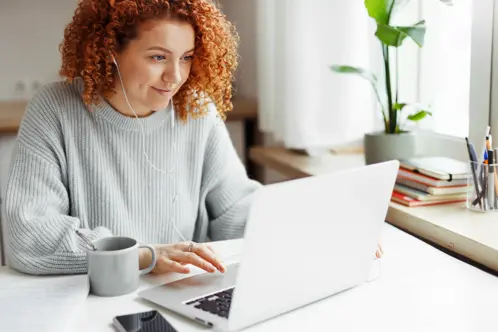 Woman looking at laptop