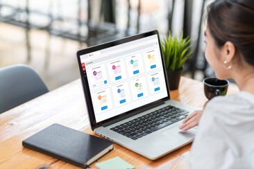 Woman looking at laptop on desk