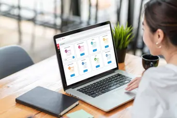 Woman looking at laptop on desk