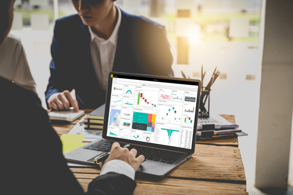 Power BI Prophix Dashboard on Laptop Screen 2