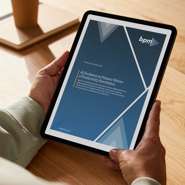 Person holding a tablet vertically with BPM partner report on it