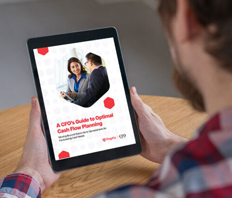 A person holding an iPad displaying text and two professionals