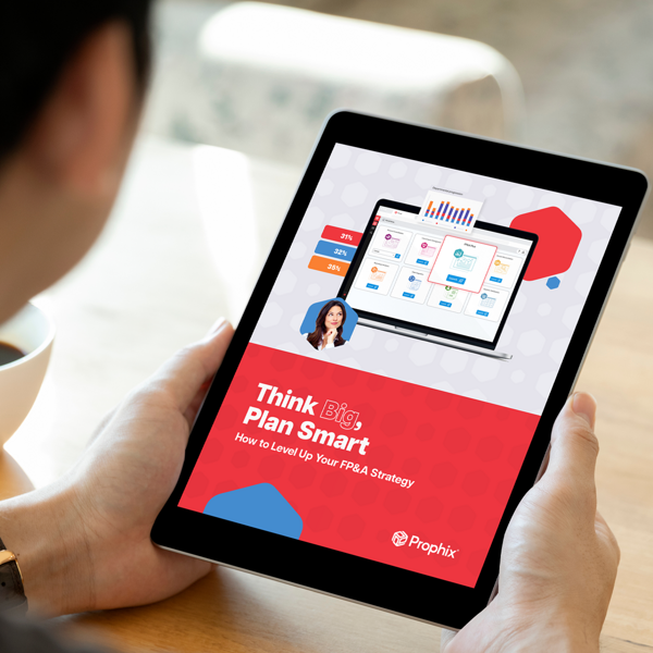 A person holding an iPad displaying text and Prophix One's home page on the screen