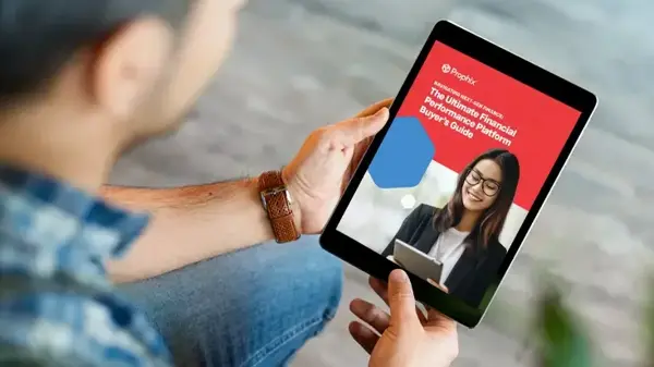 A person holding an iPad displaying an image of a smiling woman wearing glasses