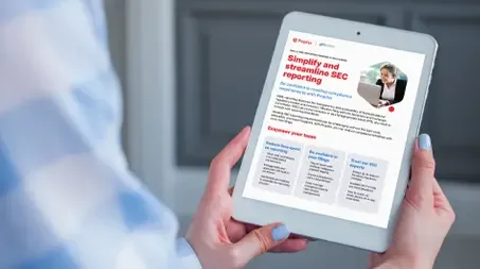 A person with blue nail polish holds an iPad displaying text on the screen