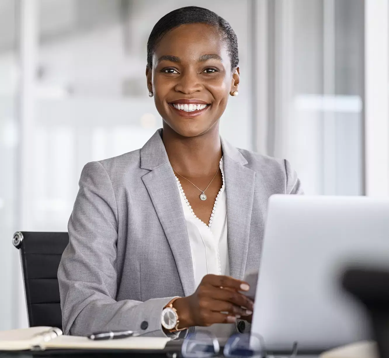 Woman smiling with laptop Prophix Image