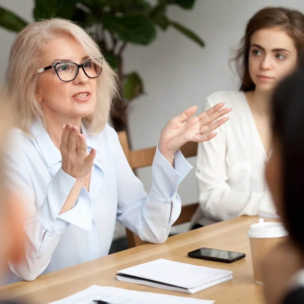 Woman speaking sitting down Prophix Image